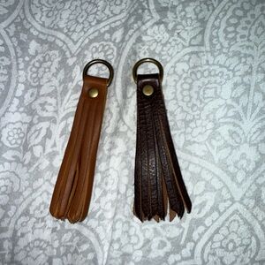 Two Portland leather tassels